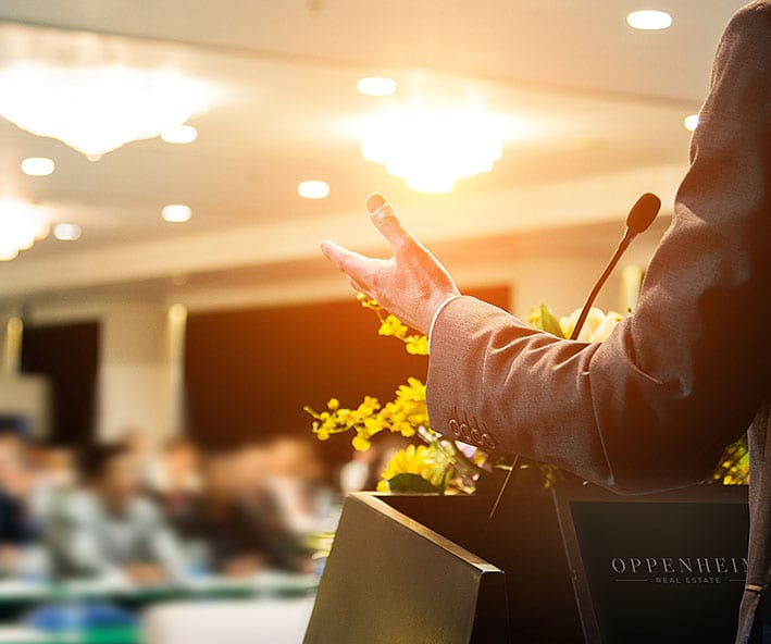 Man on platform doing a speech